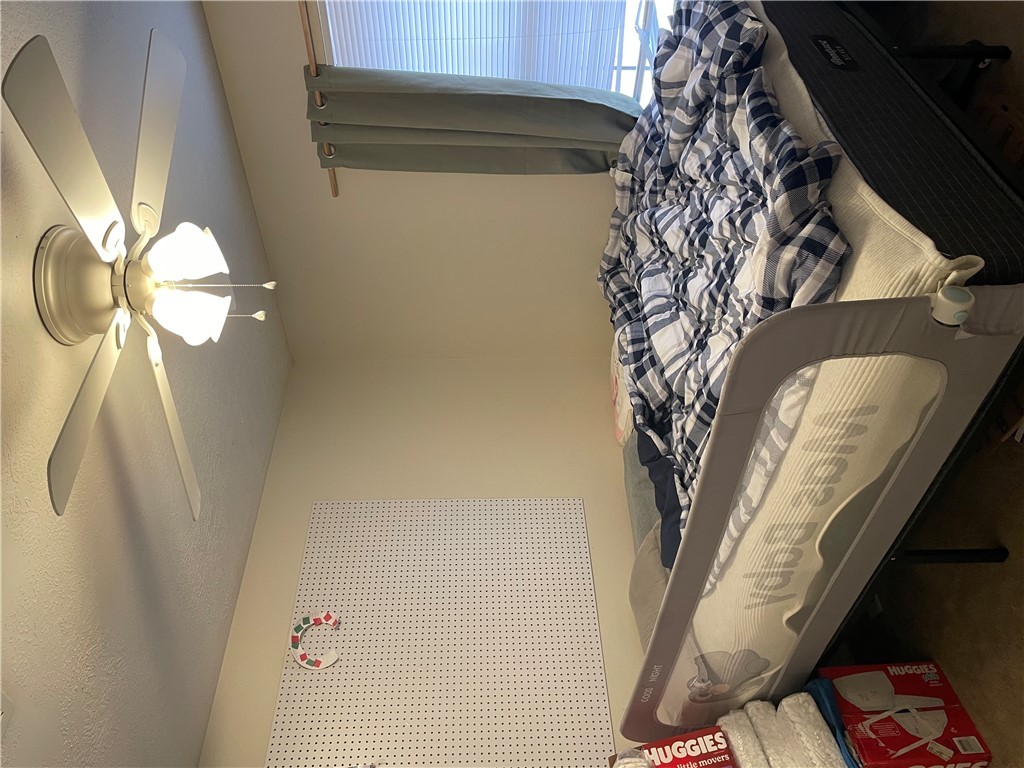 902 Azalea Court College Station, TX 77840 - Photo 6 of 10 Bedroom with ceiling fan and carpet floors