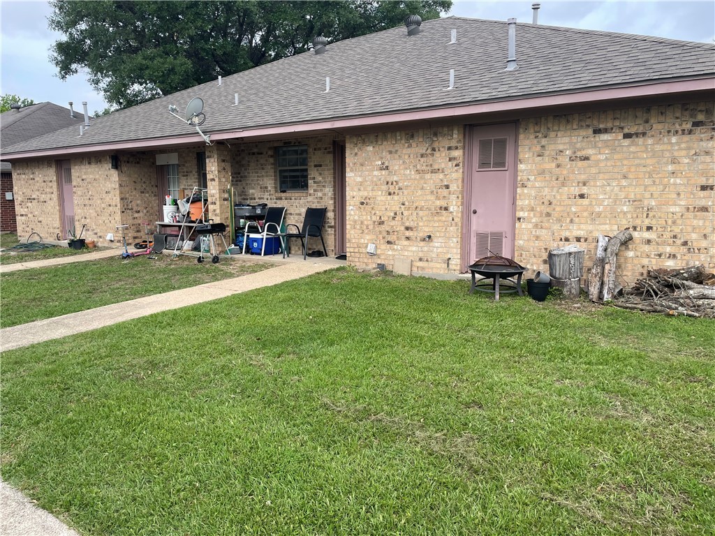 902 Azalea Court College Station, TX 77840 - Photo 10 of 10 Back of property featuring a shingled roof, brick
