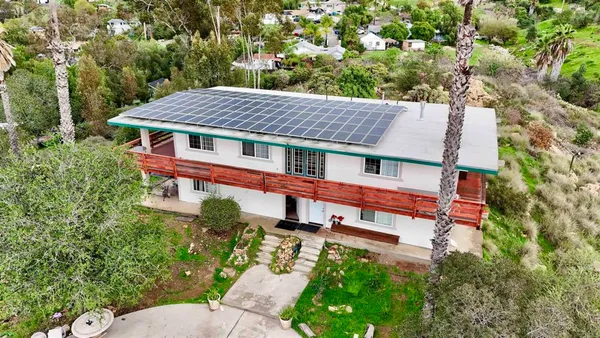 a aerial view of a house with a yard