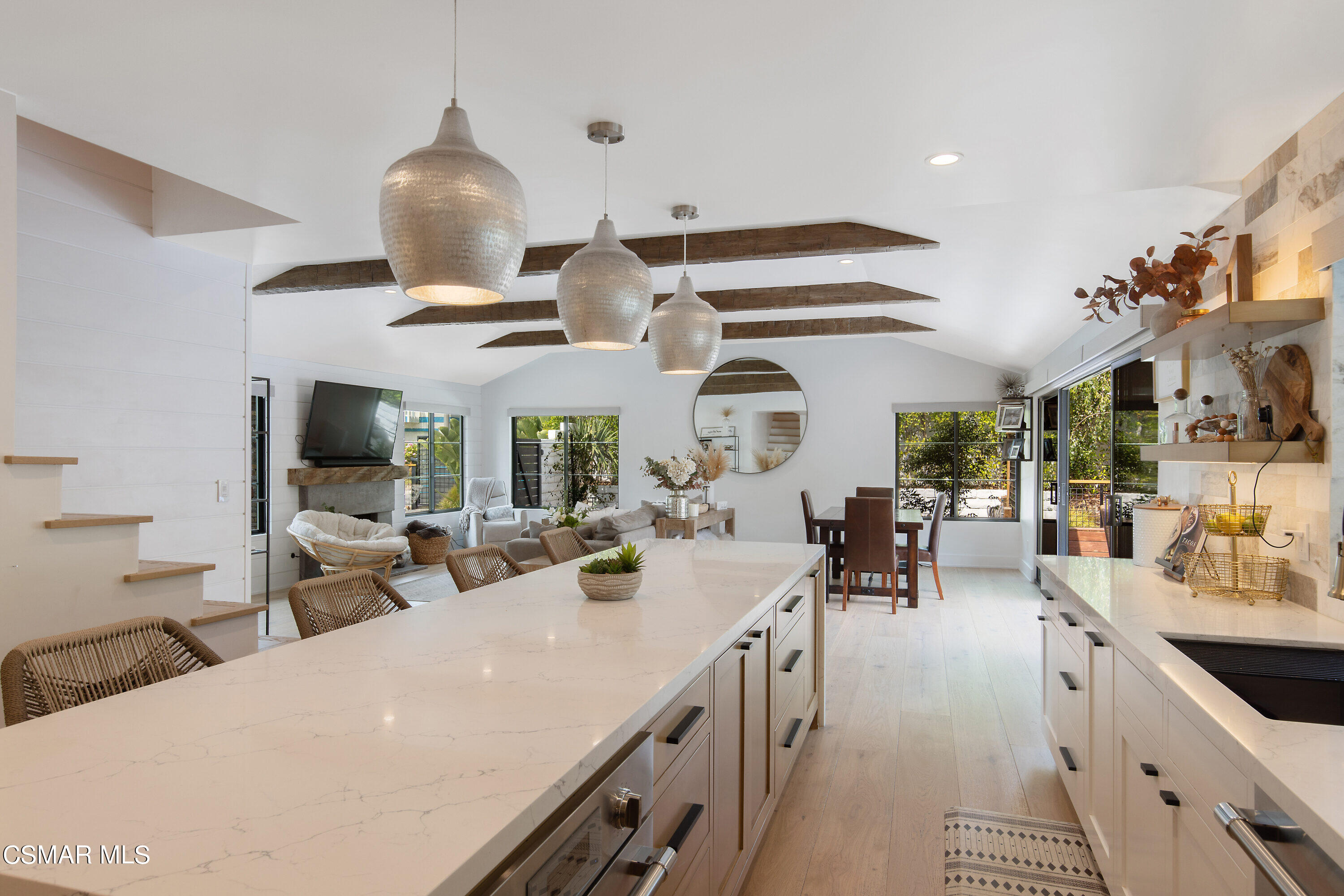 2222 Park Place Thousand Oaks, CA 91362 - Photo 21 of 60 a large kitchen with a large counter space a sink appliances and dining table