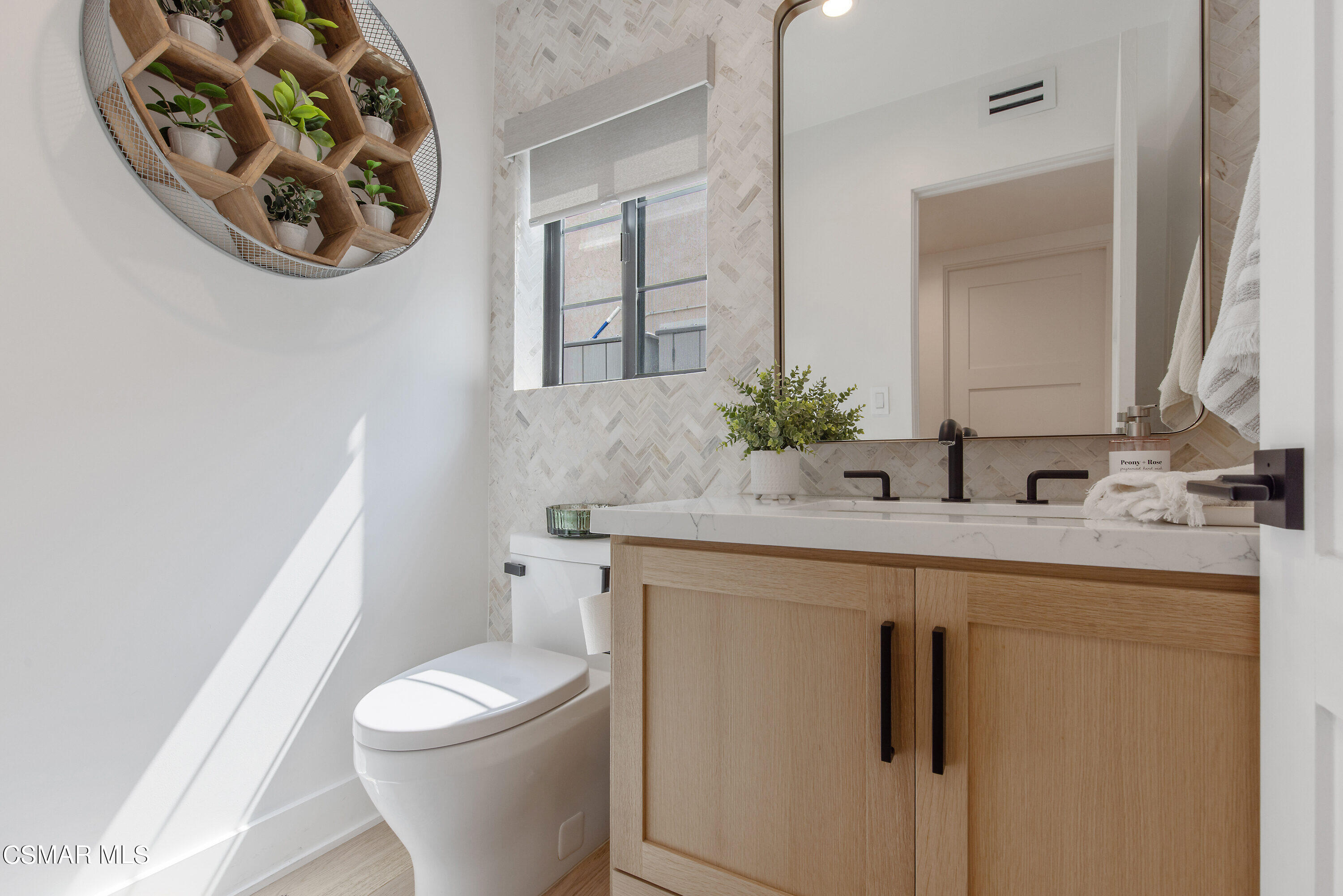 2222 Park Place Thousand Oaks, CA 91362 - Photo 25 of 60 a bathroom with a toilet a sink and a mirror