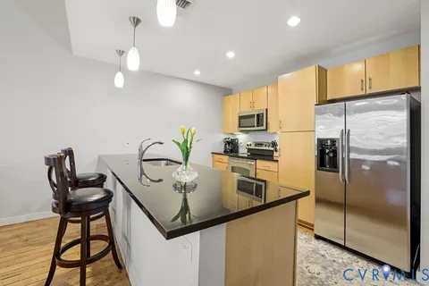 a kitchen with a sink and a window