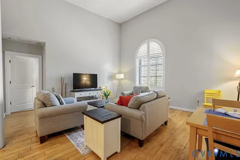 a bedroom with a bed and a potted plant