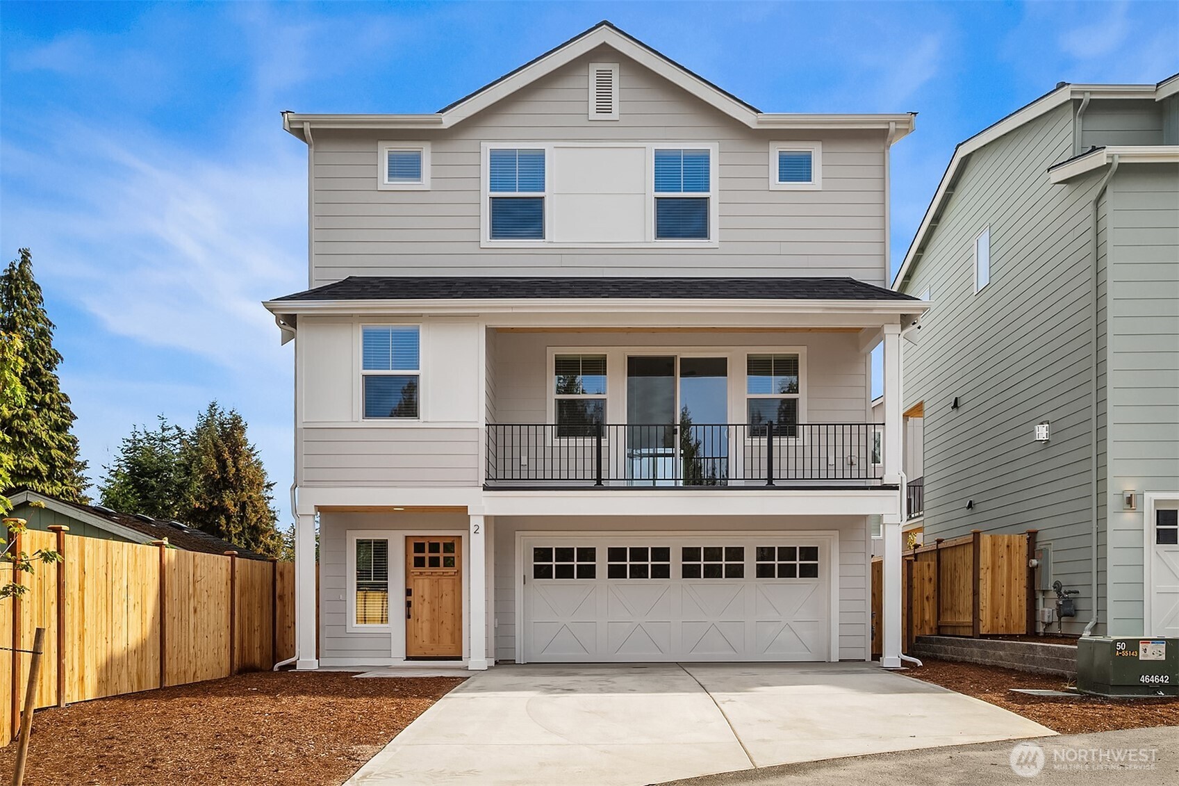 a front view of a house with a garage