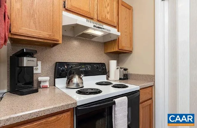 a kitchen with a stove and a microwave