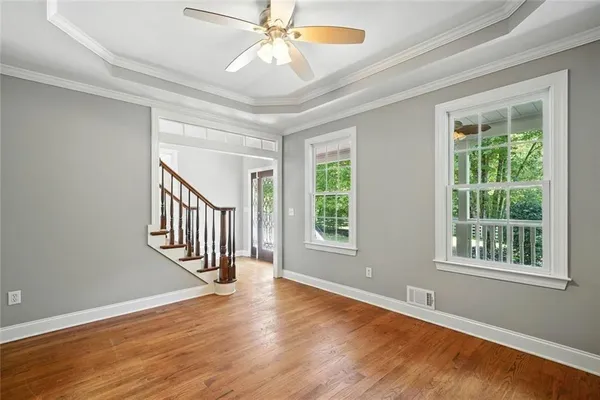 a kitchen that has a stove and a table in it