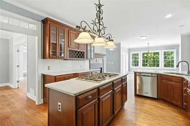 a utility room with granite countertop cabinets washer and dryer