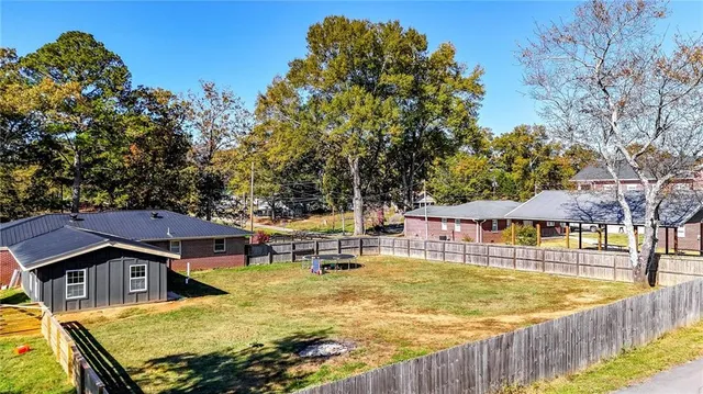 a view of a swimming pool with a patio
