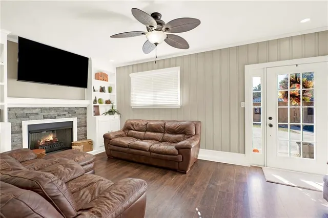 a living room with furniture fireplace and flat screen tv