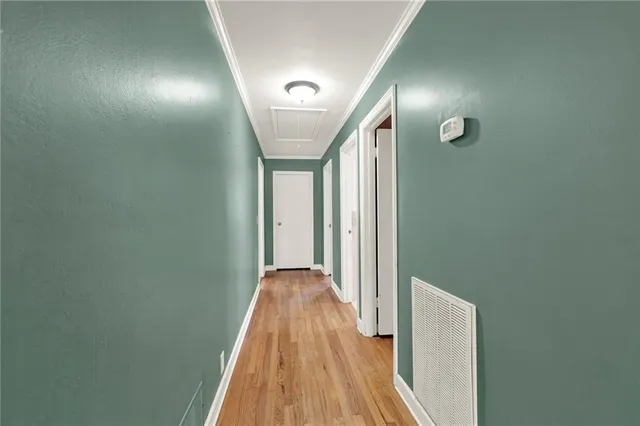 a bedroom with a bed and flat screen tv