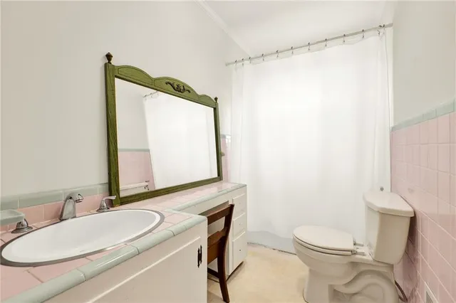 a bed sitting in a room next to a window