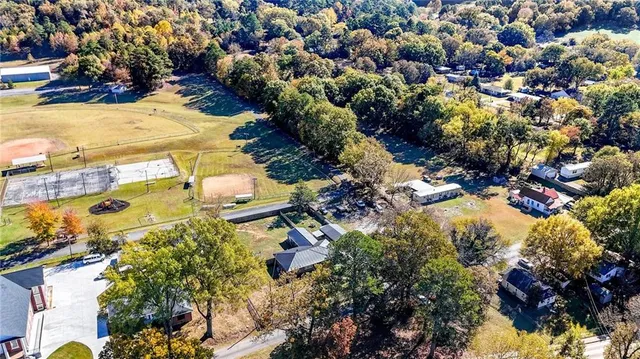 a view of a houses and covered with snow