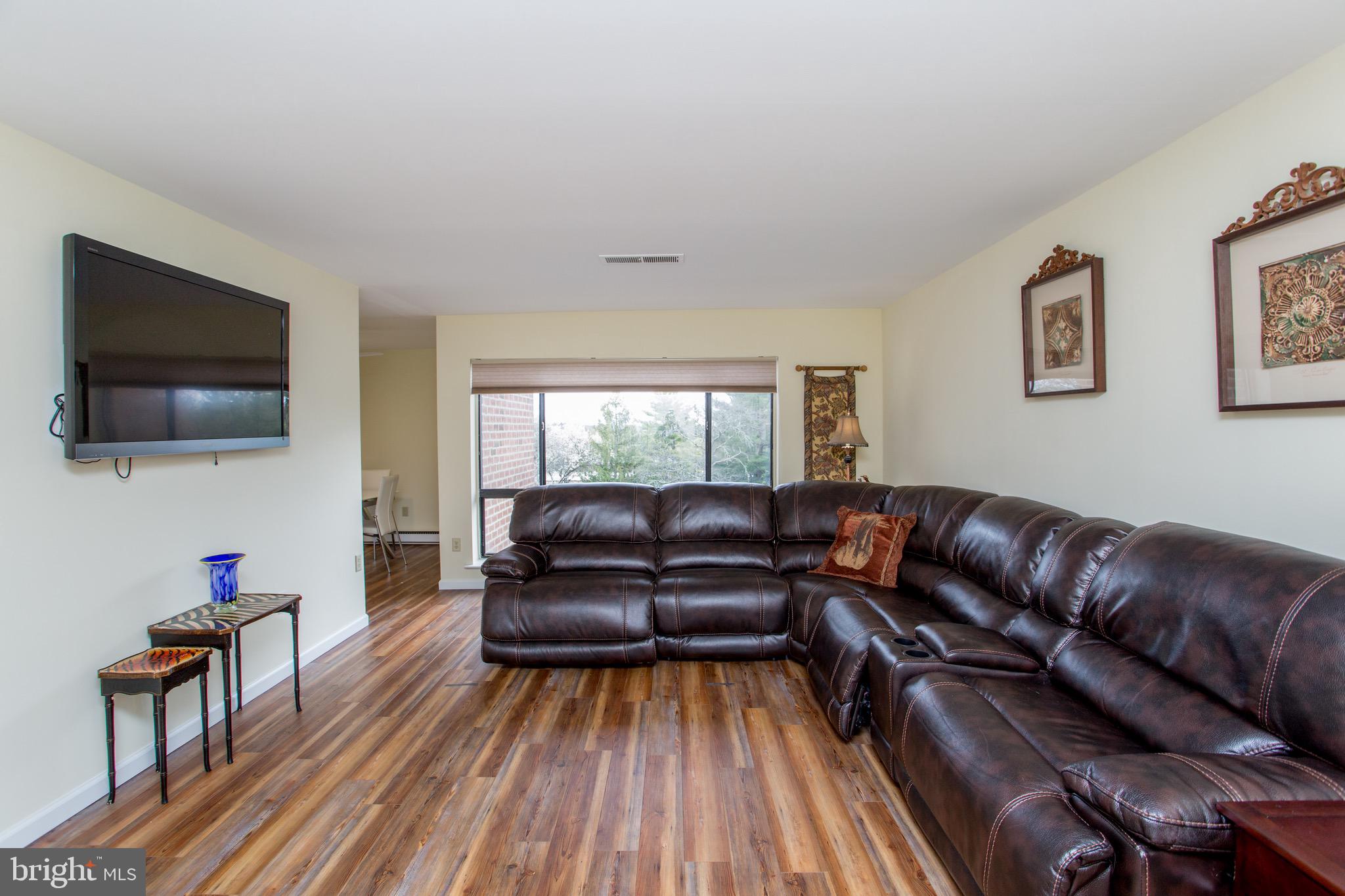 1680 Huntingdon Pike, Unit CONDO 224 Huntingdon Valley, PA 19006 - Photo 13 of 50 a living room with furniture and a flat screen tv