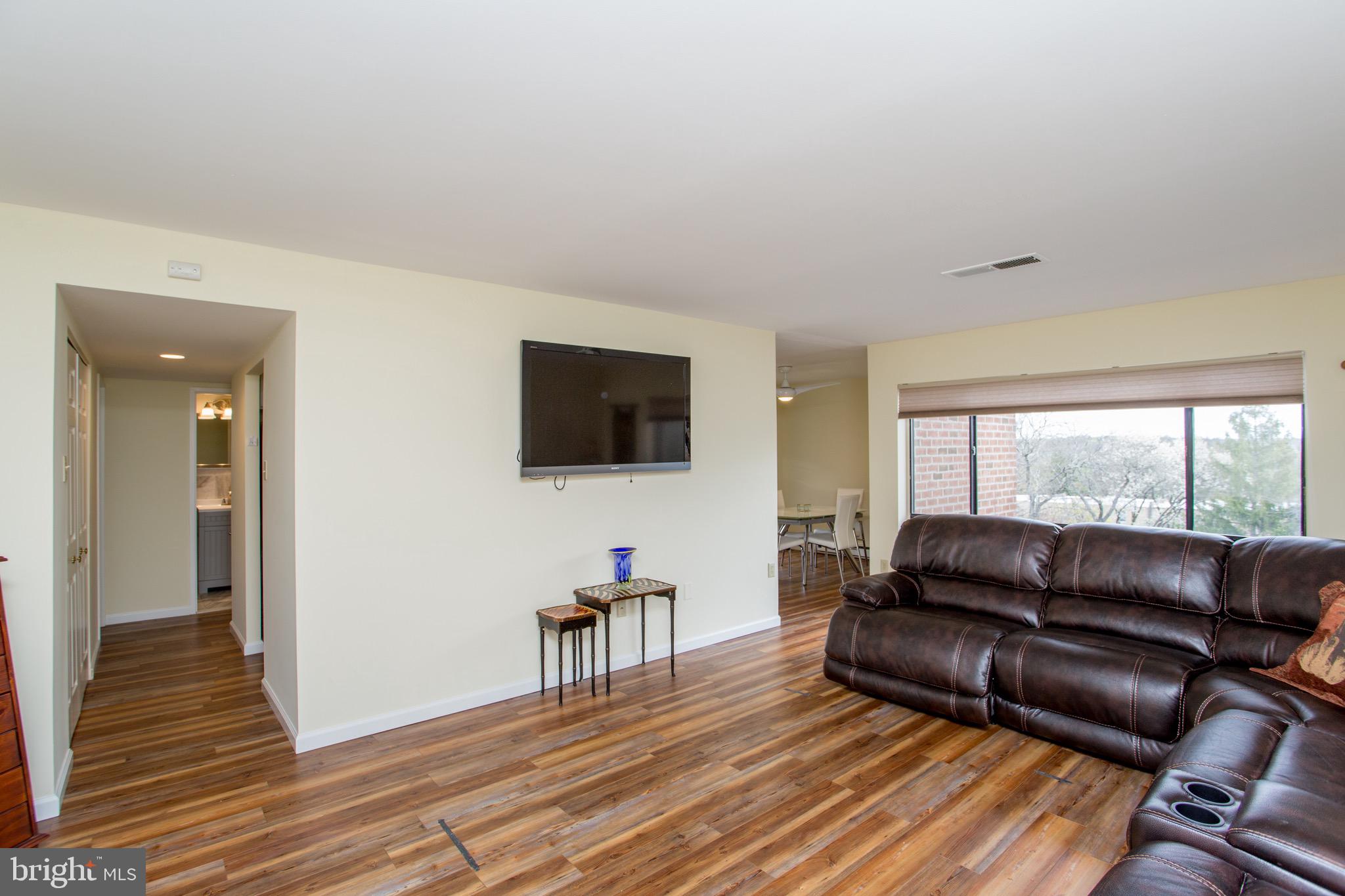 1680 Huntingdon Pike, Unit CONDO 224 Huntingdon Valley, PA 19006 - Photo 14 of 50 a living room with furniture and a flat screen tv