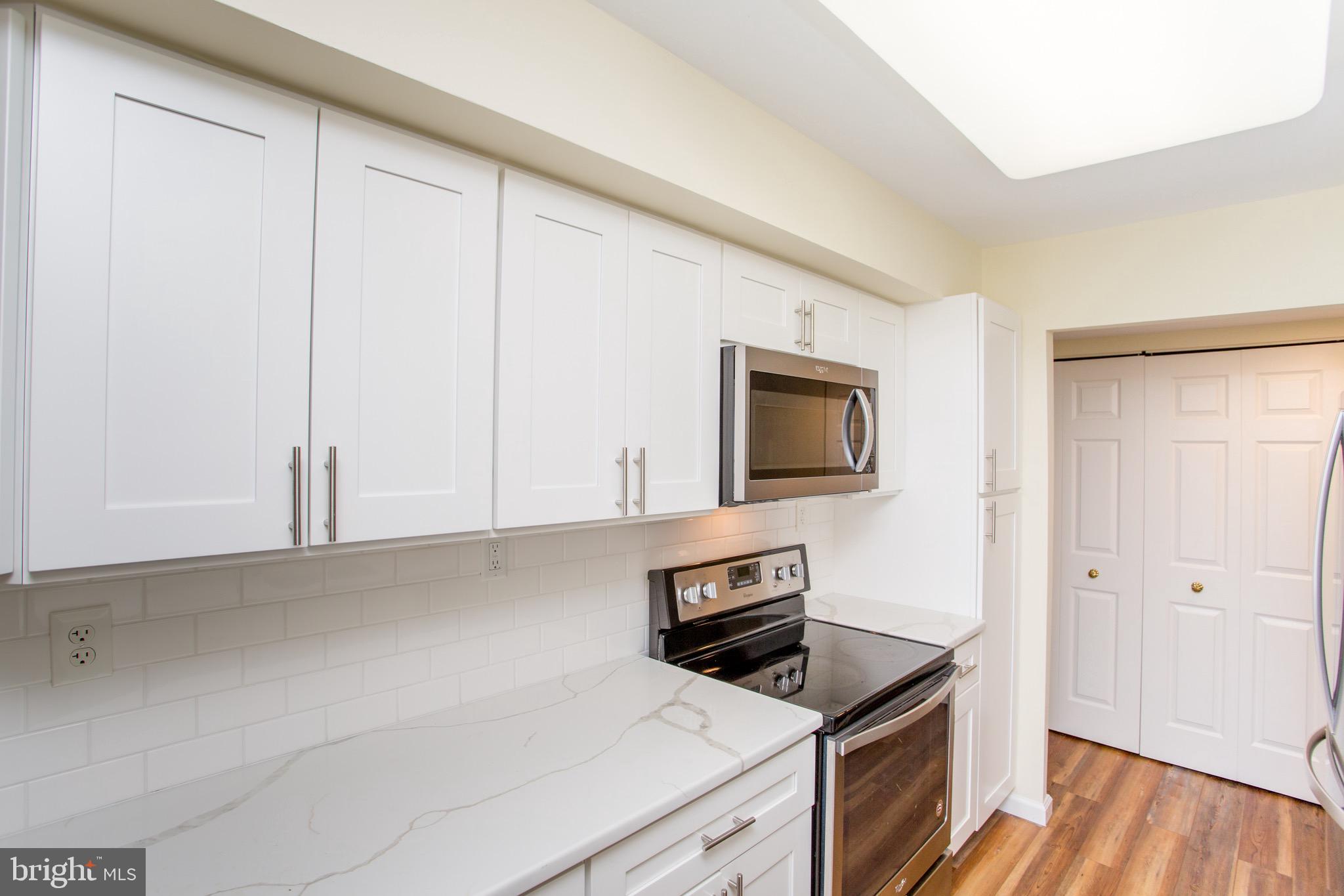 1680 Huntingdon Pike, Unit CONDO 224 Huntingdon Valley, PA 19006 - Photo 23 of 50 a kitchen with white cabinets and appliances
