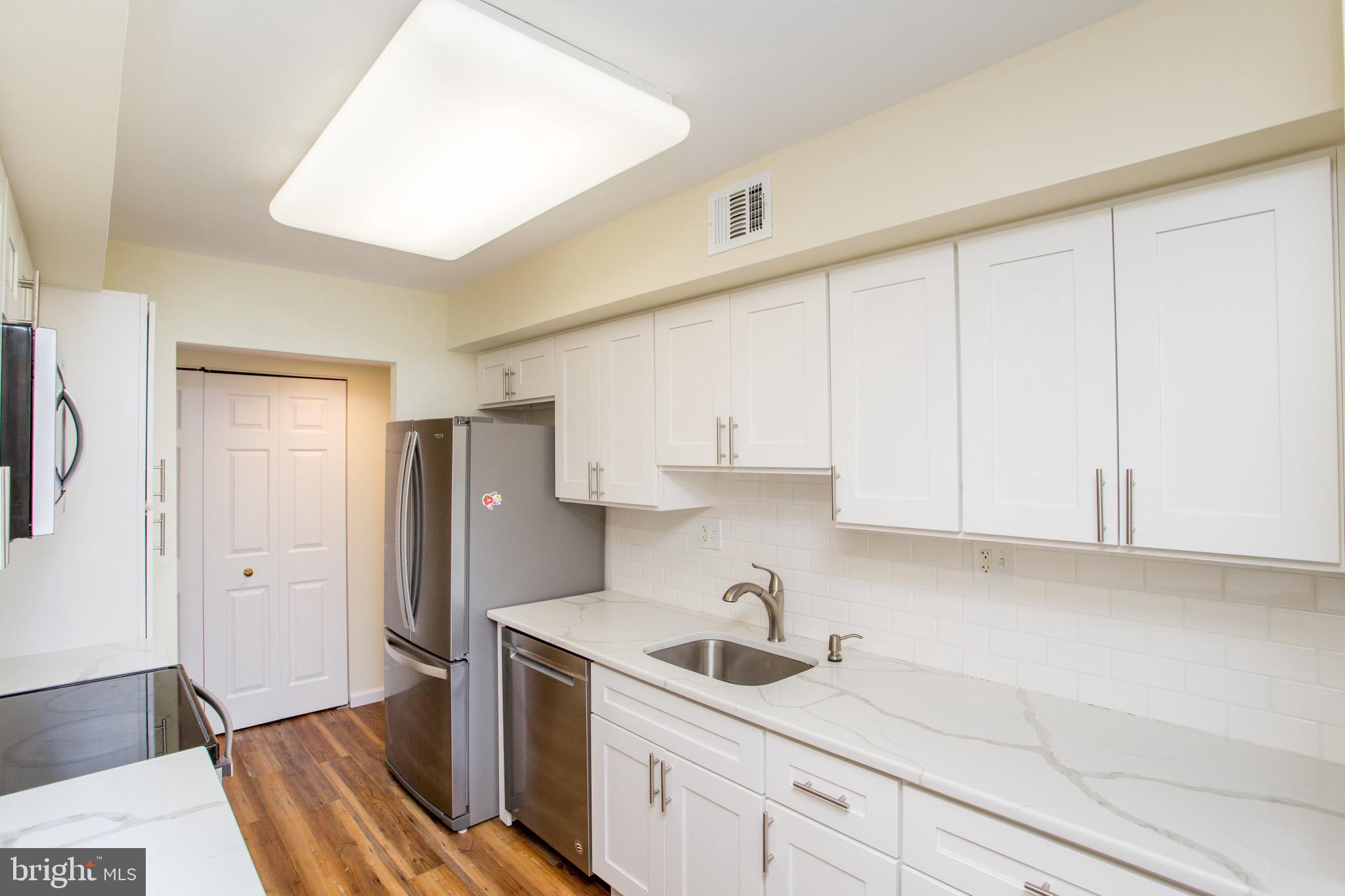 1680 Huntingdon Pike, Unit CONDO 224 Huntingdon Valley, PA 19006 - Photo 24 of 50 a kitchen with stainless steel appliances granite countertop a sink stove and refrigerator