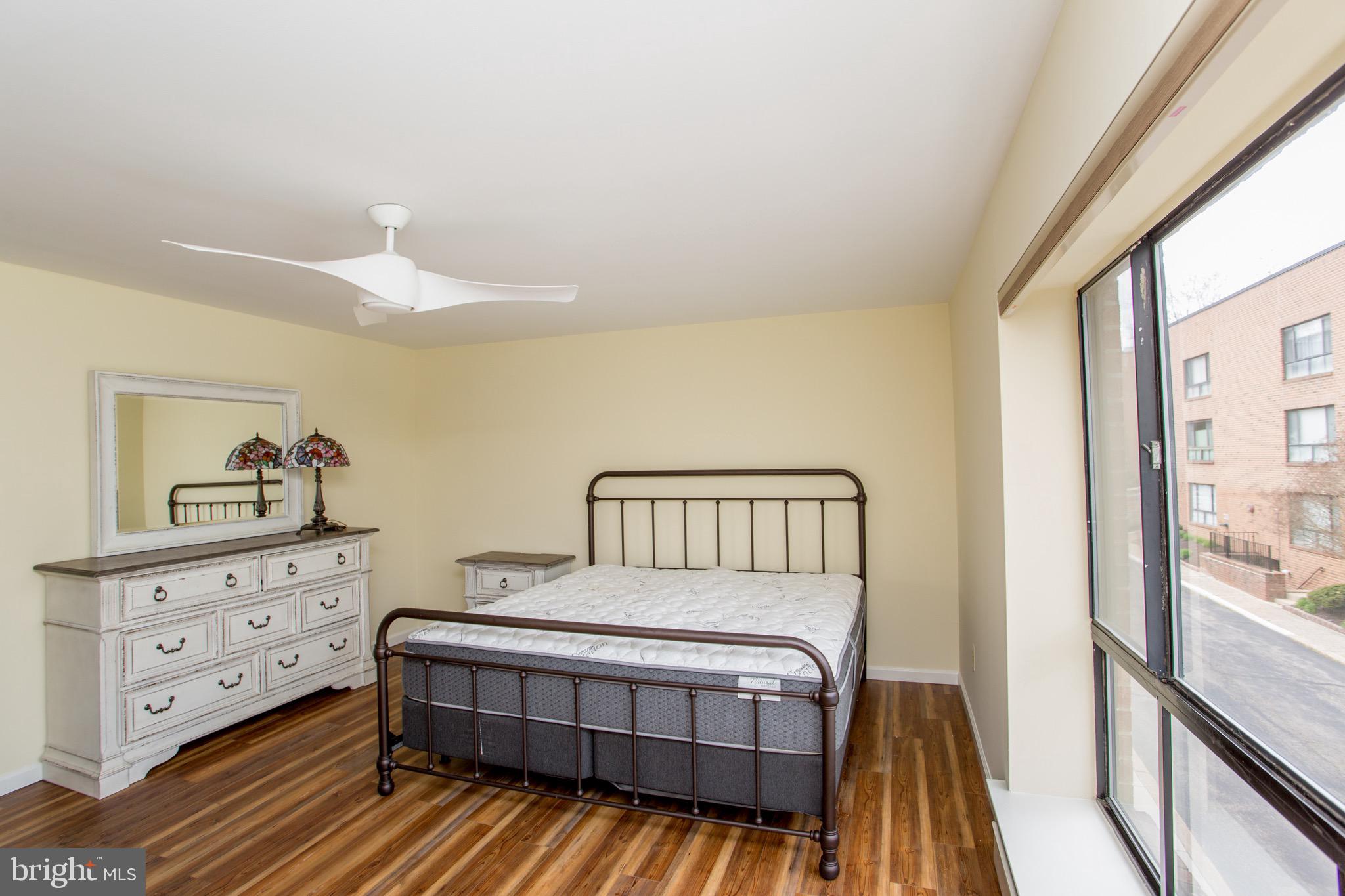 1680 Huntingdon Pike, Unit CONDO 224 Huntingdon Valley, PA 19006 - Photo 31 of 50 a spacious bedroom with a bed and a window