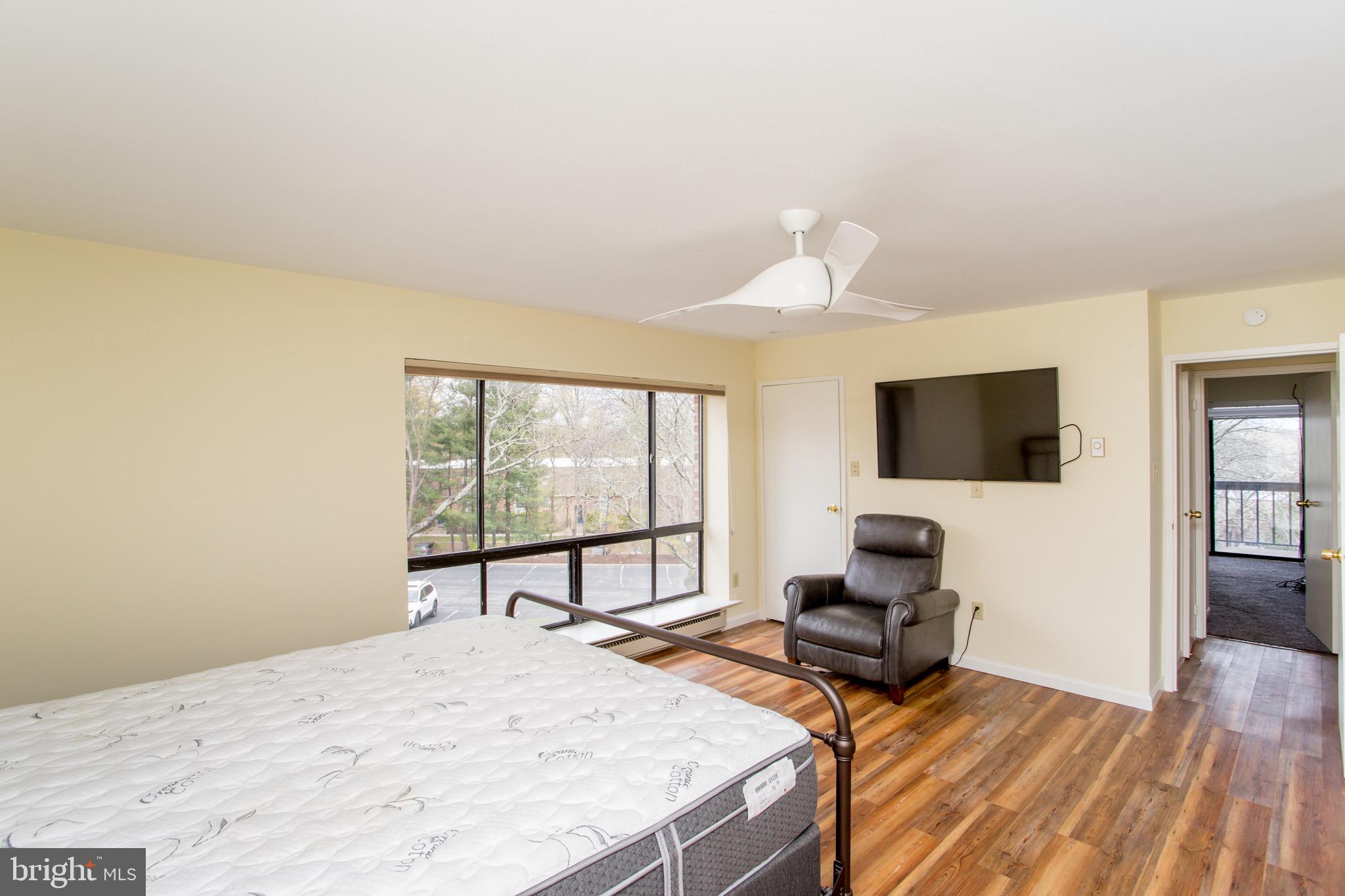 1680 Huntingdon Pike, Unit CONDO 224 Huntingdon Valley, PA 19006 - Photo 32 of 50 a bedroom with a bed and a flat screen tv