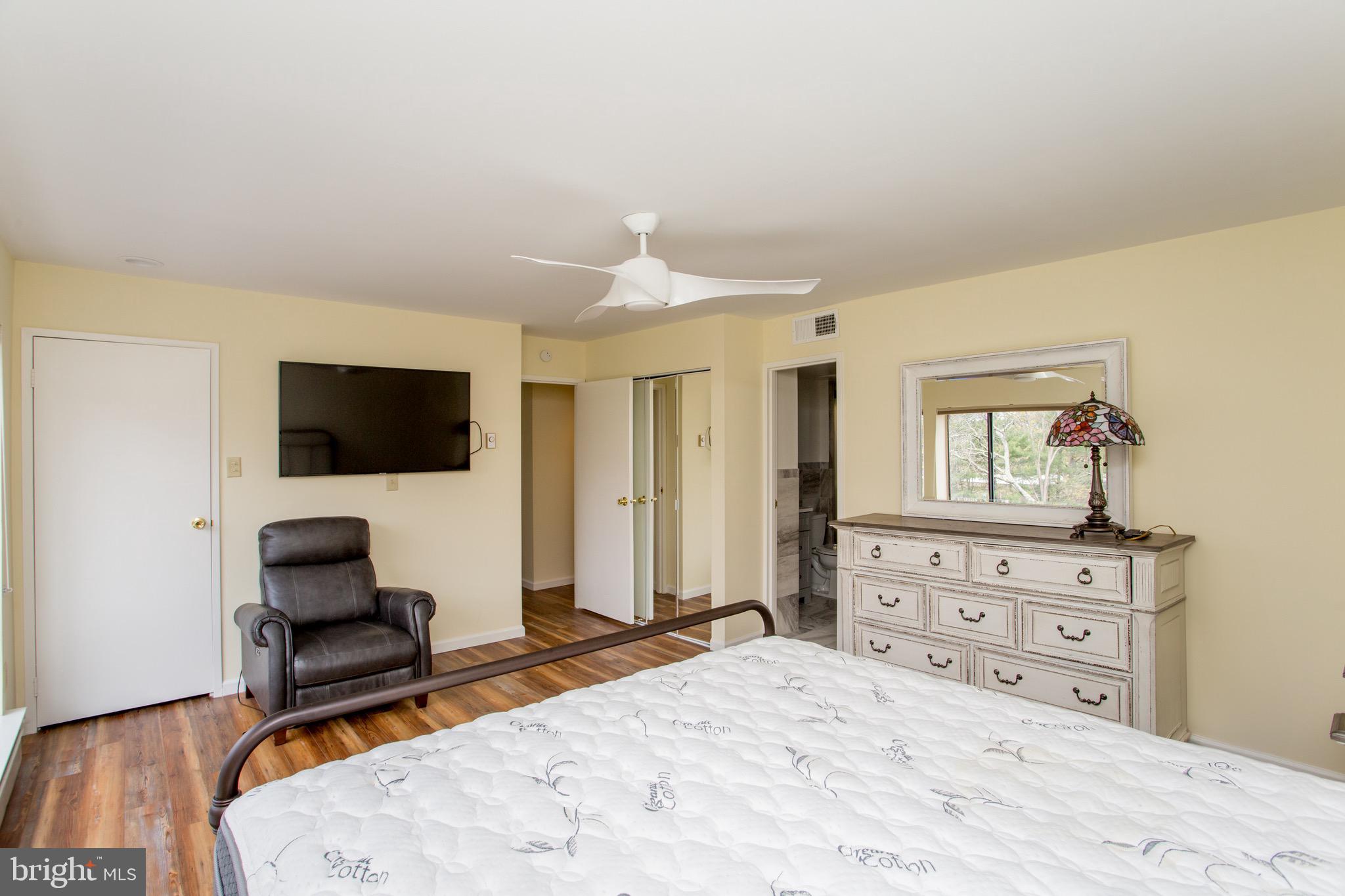 1680 Huntingdon Pike, Unit CONDO 224 Huntingdon Valley, PA 19006 - Photo 33 of 50 a bedroom with a bed and a flat screen tv