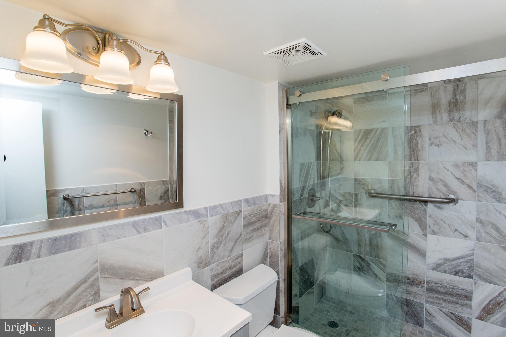 1680 Huntingdon Pike, Unit CONDO 224 Huntingdon Valley, PA 19006 - Photo 34 of 50 a bathroom with a sink mirror and shower