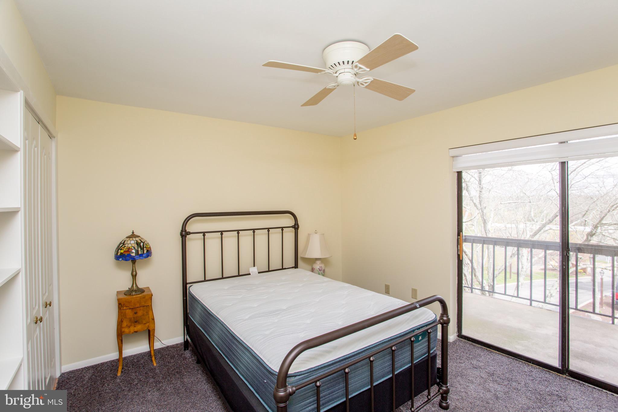 1680 Huntingdon Pike, Unit CONDO 224 Huntingdon Valley, PA 19006 - Photo 36 of 50 a bedroom with a bed and a chandelier