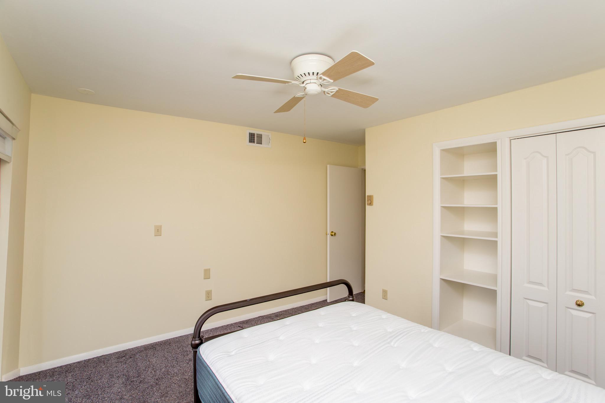 1680 Huntingdon Pike, Unit CONDO 224 Huntingdon Valley, PA 19006 - Photo 38 of 50 a bedroom with a bed and a ceiling fan