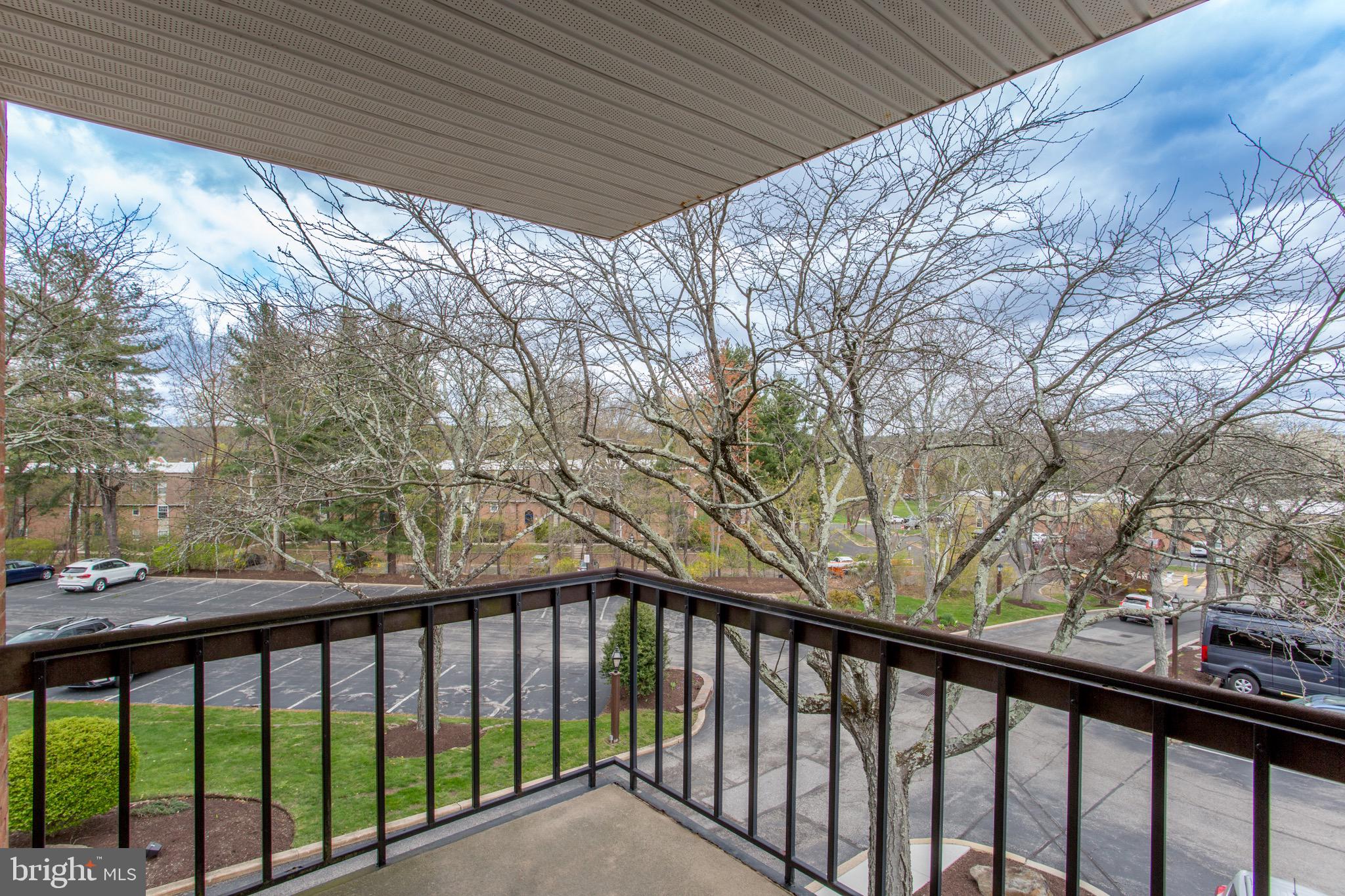 1680 Huntingdon Pike, Unit CONDO 224 Huntingdon Valley, PA 19006 - Photo 40 of 50 a balcony with trees in front of it