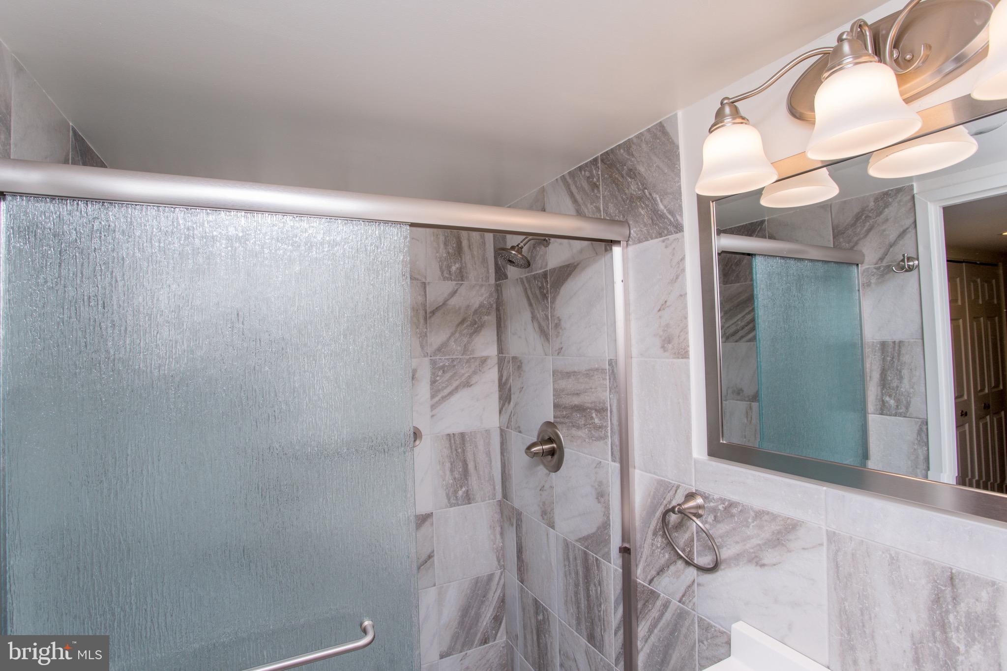 1680 Huntingdon Pike, Unit CONDO 224 Huntingdon Valley, PA 19006 - Photo 45 of 50 a bathroom with a shower and a sink