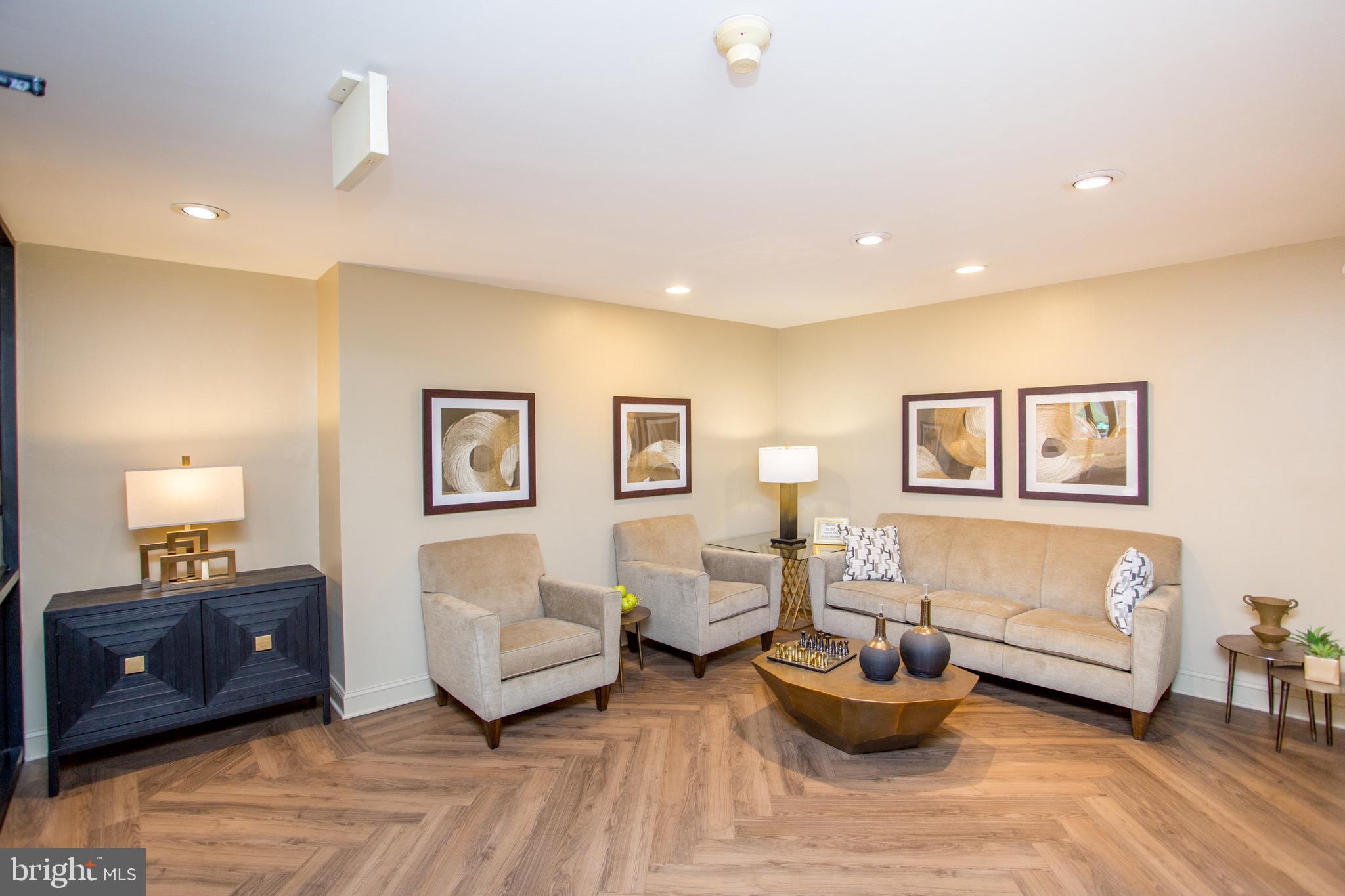 1680 Huntingdon Pike, Unit CONDO 224 Huntingdon Valley, PA 19006 - Photo 49 of 50 a living room with furniture and a couch