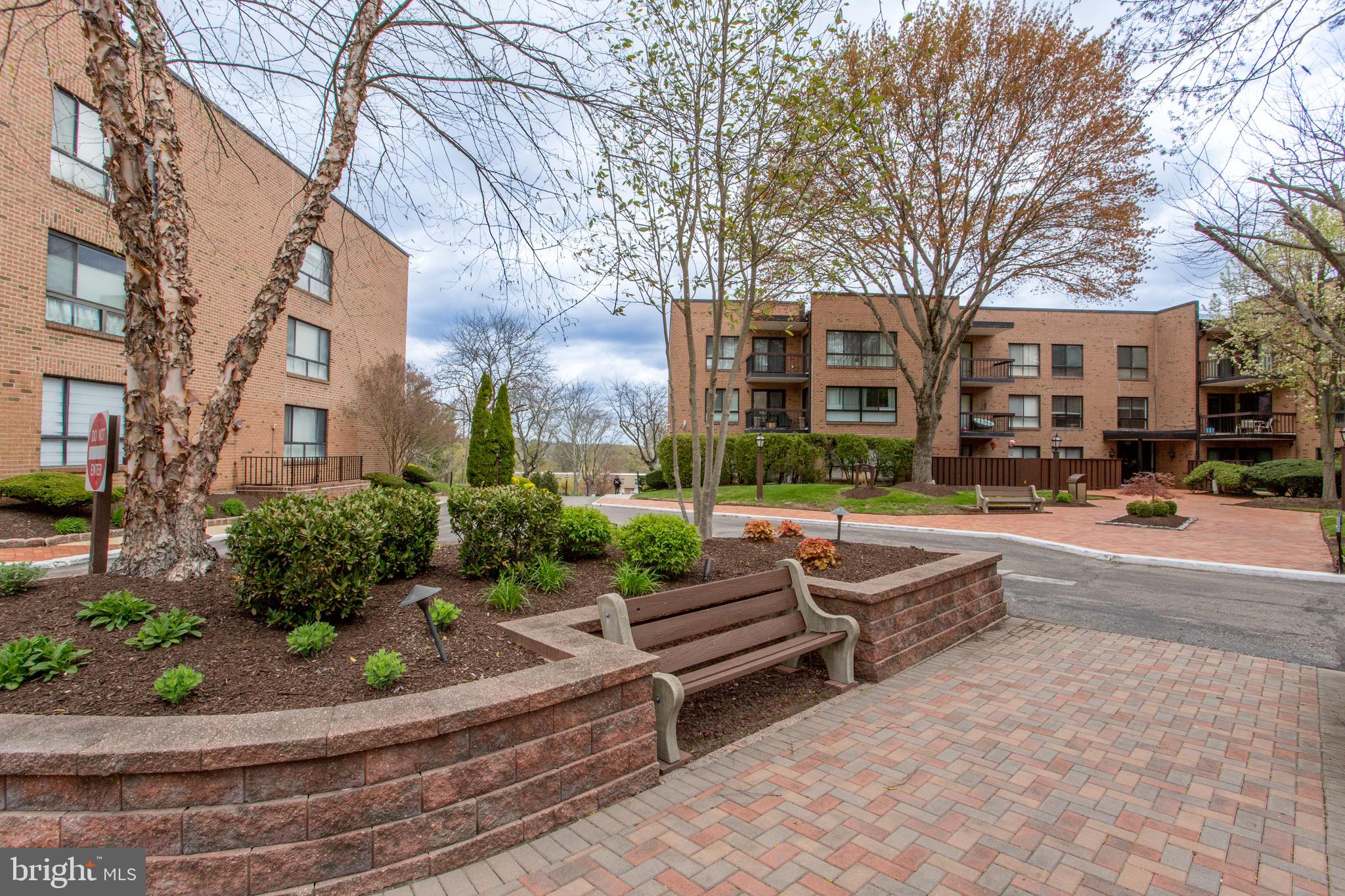 1680 Huntingdon Pike, Unit CONDO 224 Huntingdon Valley, PA 19006 - Photo 6 of 50 a view of a building with cars parked on the road