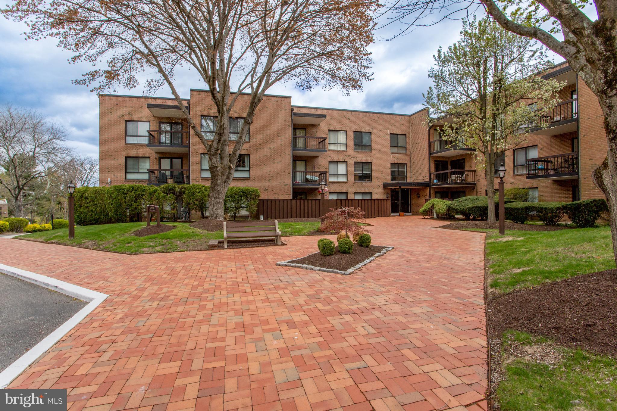 1680 Huntingdon Pike, Unit CONDO 224 Huntingdon Valley, PA 19006 - Photo 7 of 50 a view of a building with a yard