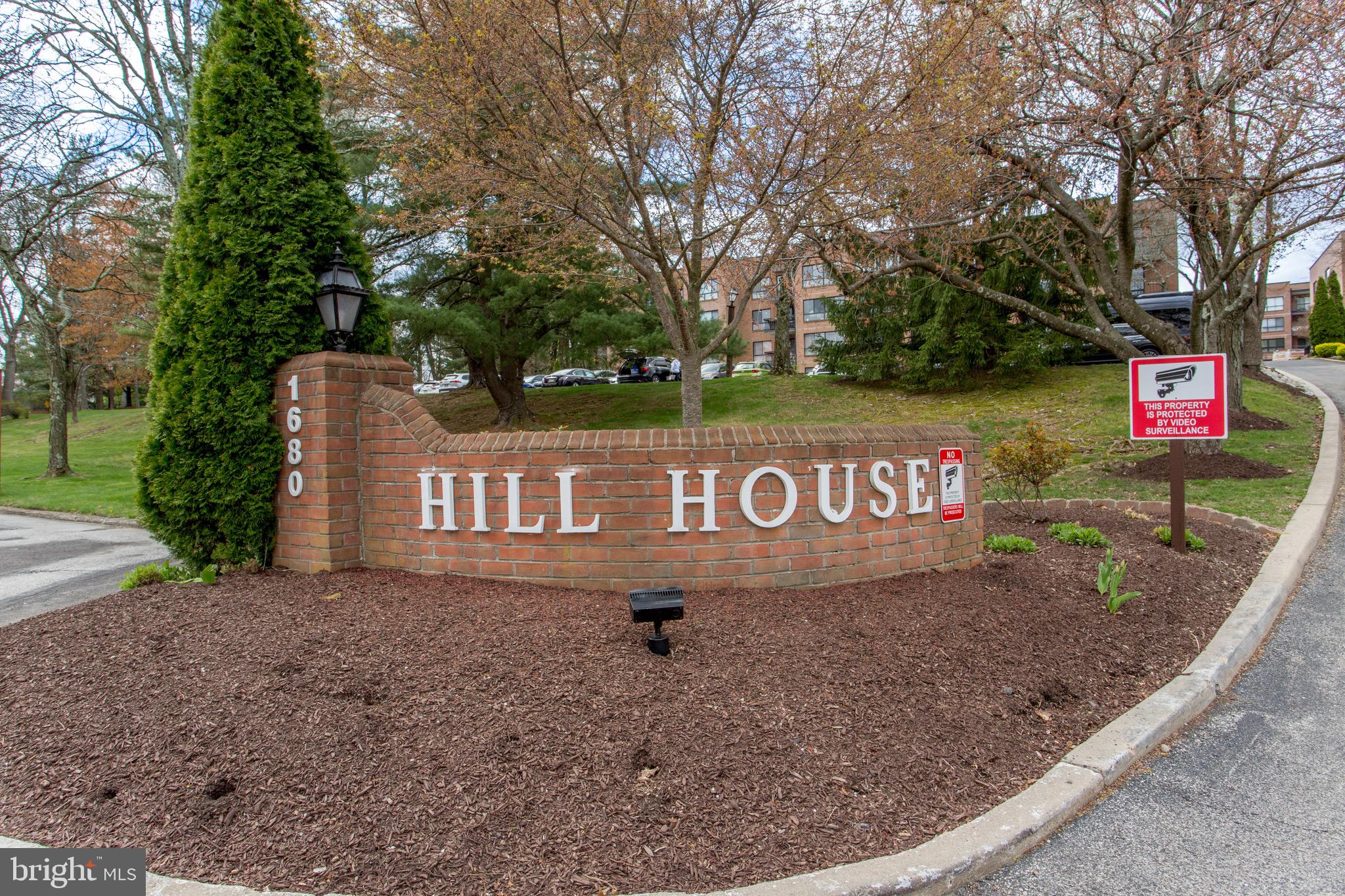 1680 Huntingdon Pike, Unit CONDO 224 Huntingdon Valley, PA 19006 - Photo 8 of 50 a view of a street sign under a large tree