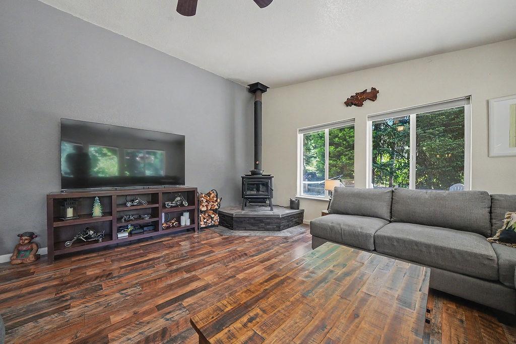 26845 Spring Court Pioneer, CA 95666 - Photo 24 of 89 a living room with furniture and a flat screen tv