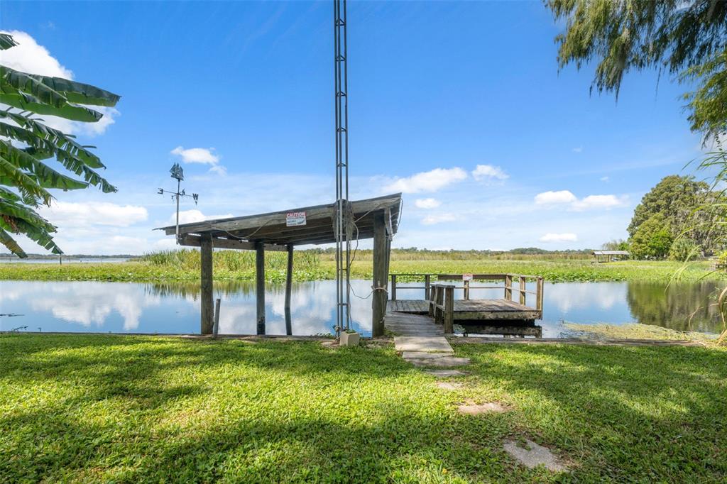 7965 West Riverbend Road Crystal River, FL 34428 - Photo 13 of 60 a view of a house with a yard