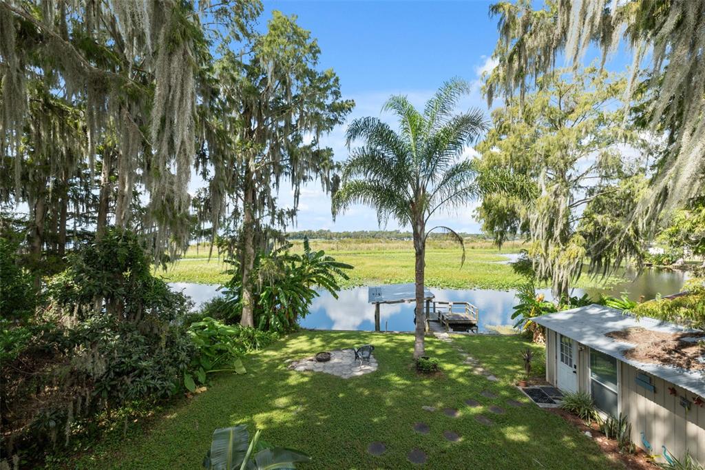 7965 West Riverbend Road Crystal River, FL 34428 - Photo 2 of 60 a view of a yard with a tree