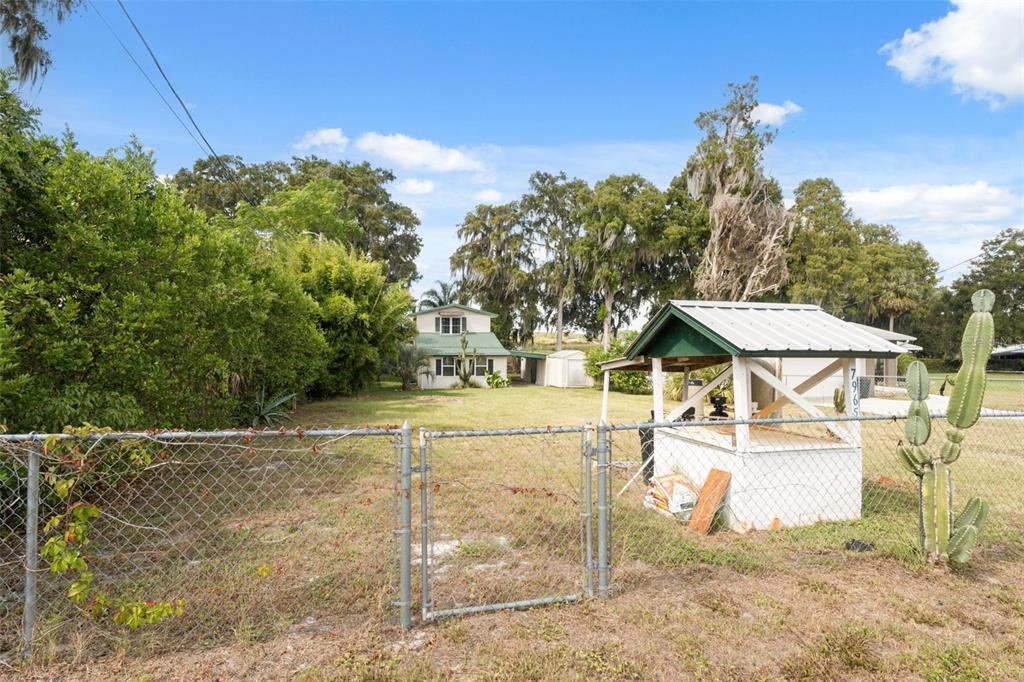 7965 West Riverbend Road Crystal River, FL 34428 - Photo 25 of 60 a view of a house with a yard