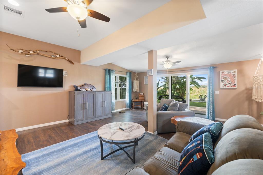 7965 West Riverbend Road Crystal River, FL 34428 - Photo 33 of 60 a living room with furniture and a flat screen tv