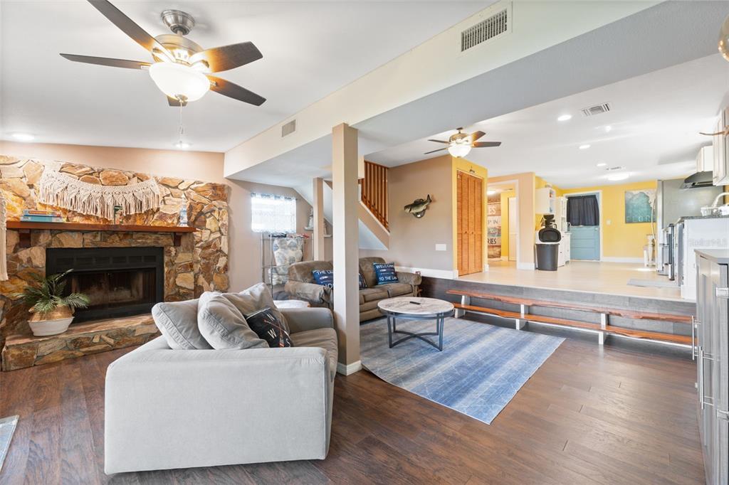 7965 West Riverbend Road Crystal River, FL 34428 - Photo 34 of 60 a living room with furniture and a fireplace