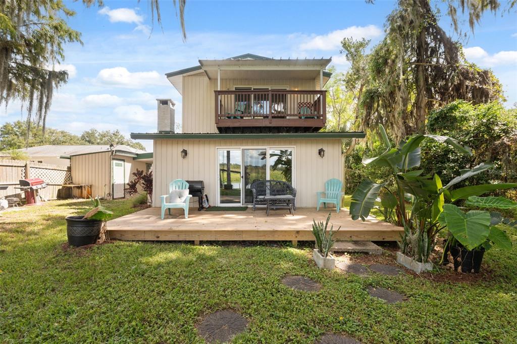 7965 West Riverbend Road Crystal River, FL 34428 - Photo 42 of 60 a view of a house with backyard porch and sitting area