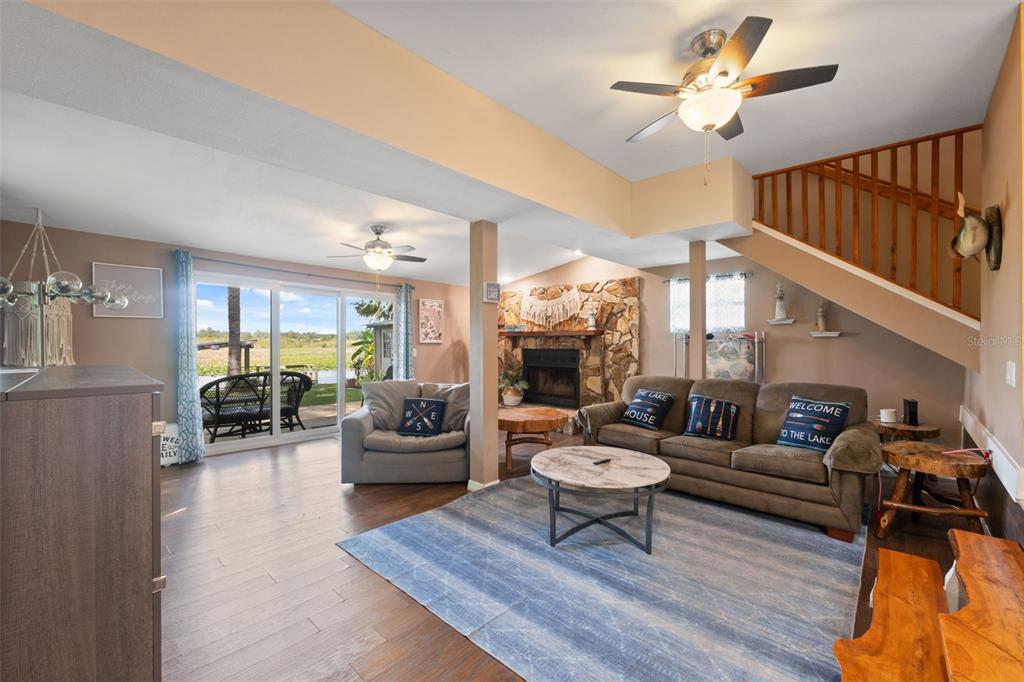 7965 West Riverbend Road Crystal River, FL 34428 - Photo 5 of 60 a living room with furniture a rug potted plant and a large window