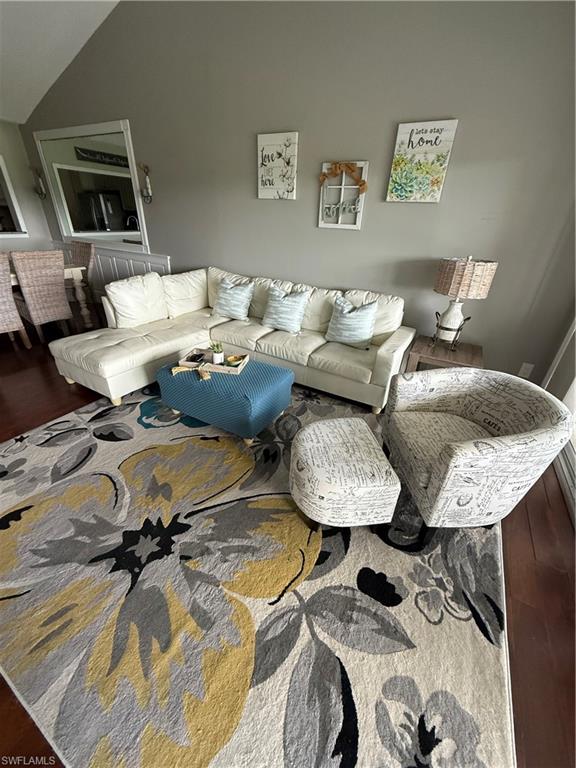 760 Augusta Boulevard, Unit D204 Naples, FL 34113 - Photo 7 of 32 a living room with furniture and a wooden floor
