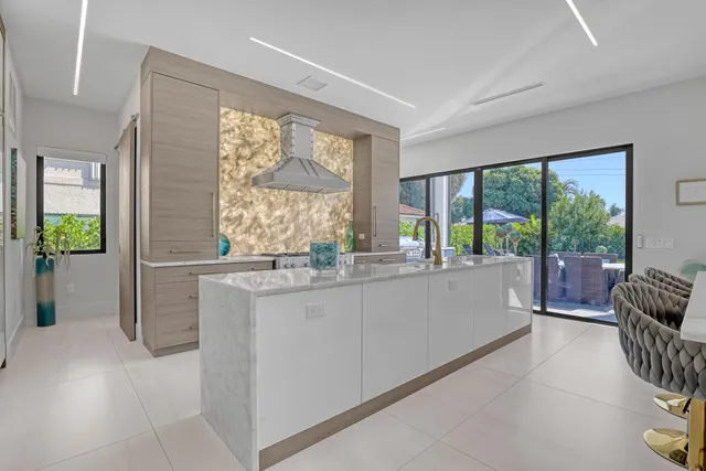 a bathroom with a toilet sink vanity and mirror
