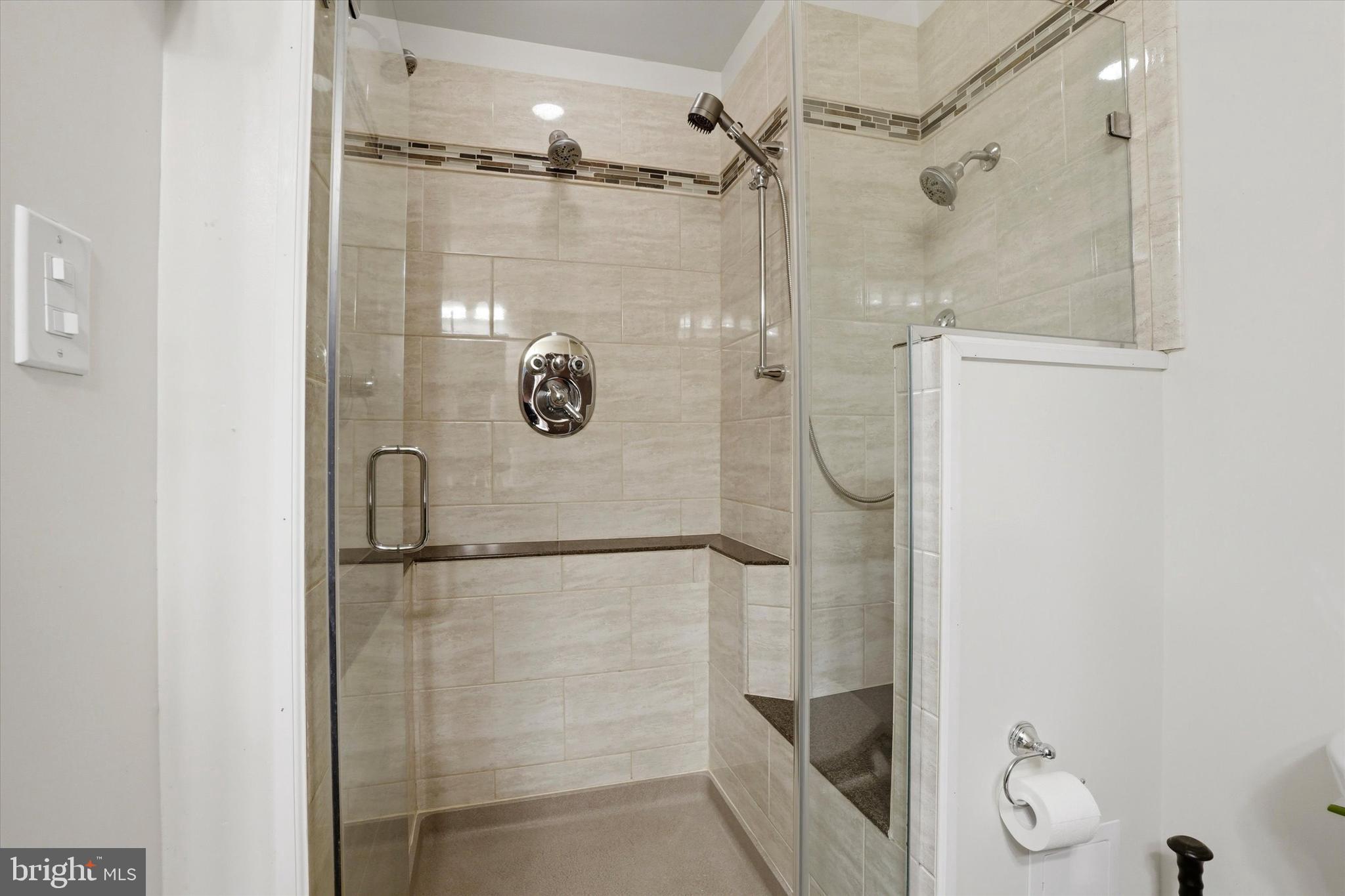 28 Sycamore Road Levittown, PA 19056 - Photo 14 of 31 a bathroom with a glass shower door