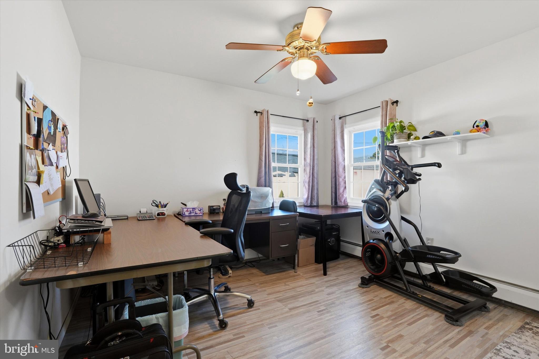 28 Sycamore Road Levittown, PA 19056 - Photo 15 of 31 a view of a workspace with furniture gym equipment and windows