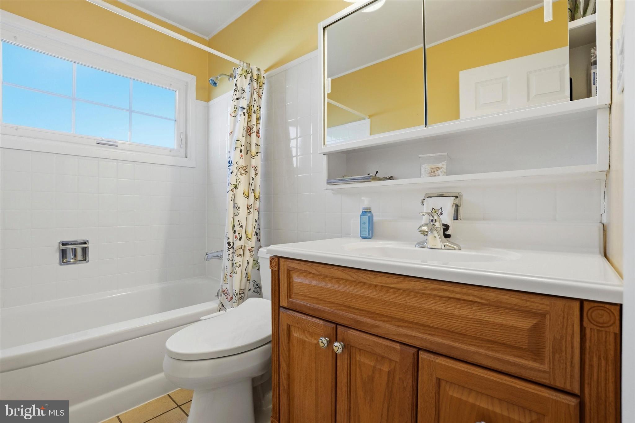 28 Sycamore Road Levittown, PA 19056 - Photo 16 of 31 a bathroom with a sink a toilet and shower