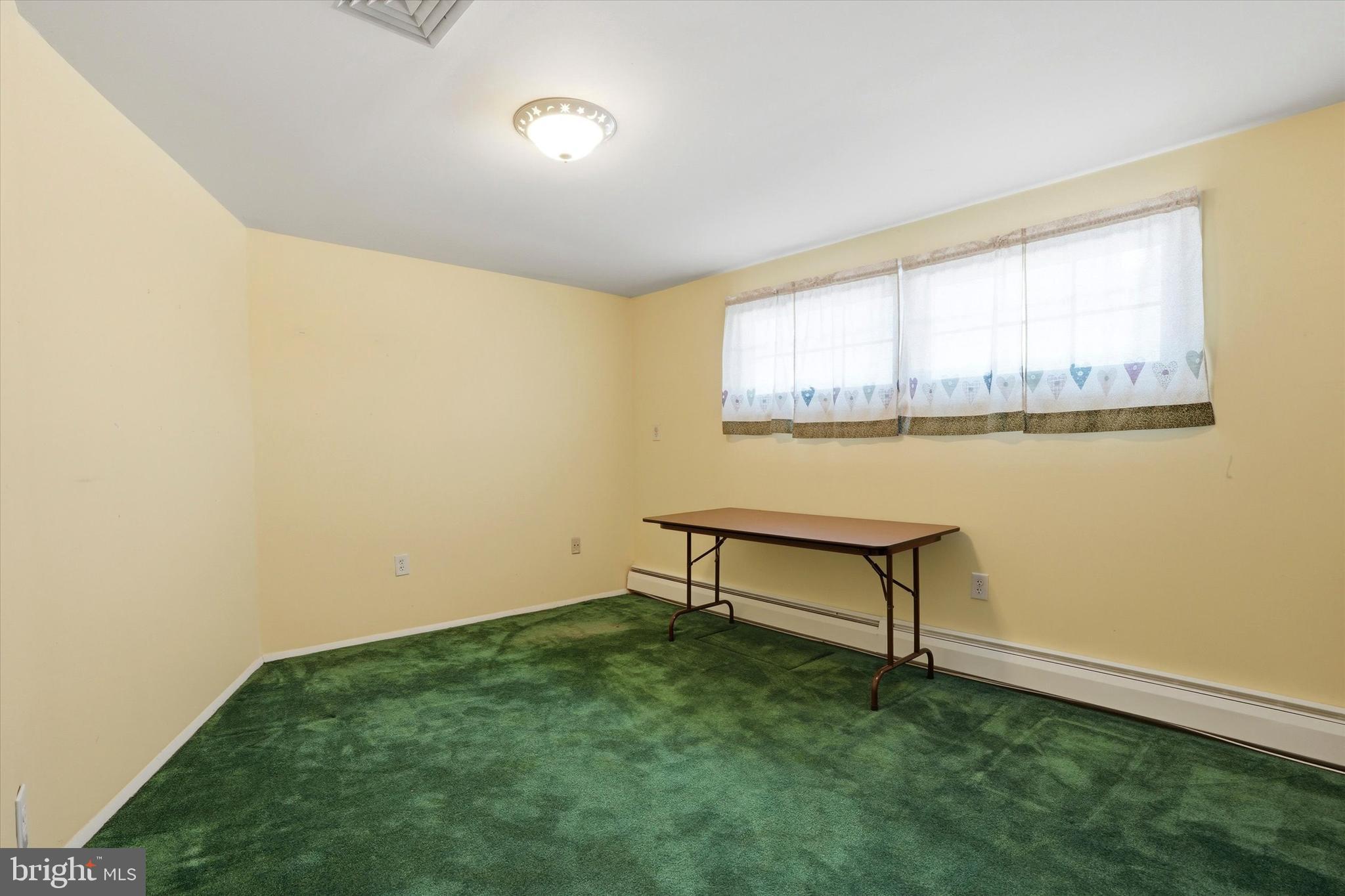 28 Sycamore Road Levittown, PA 19056 - Photo 20 of 31 a view of a room with window and a wooden bench