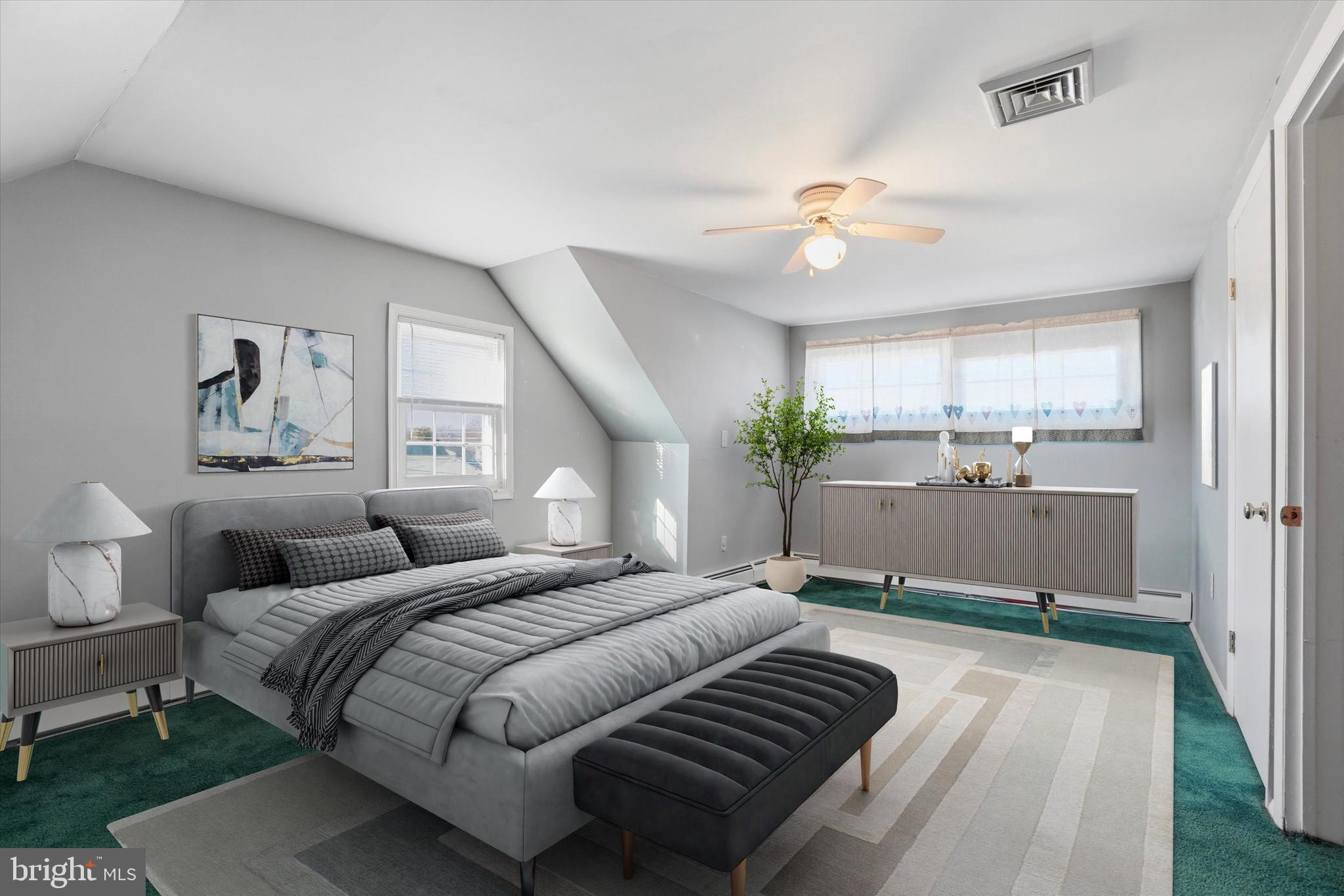 28 Sycamore Road Levittown, PA 19056 - Photo 21 of 31 a bedroom with a bed and a chandelier