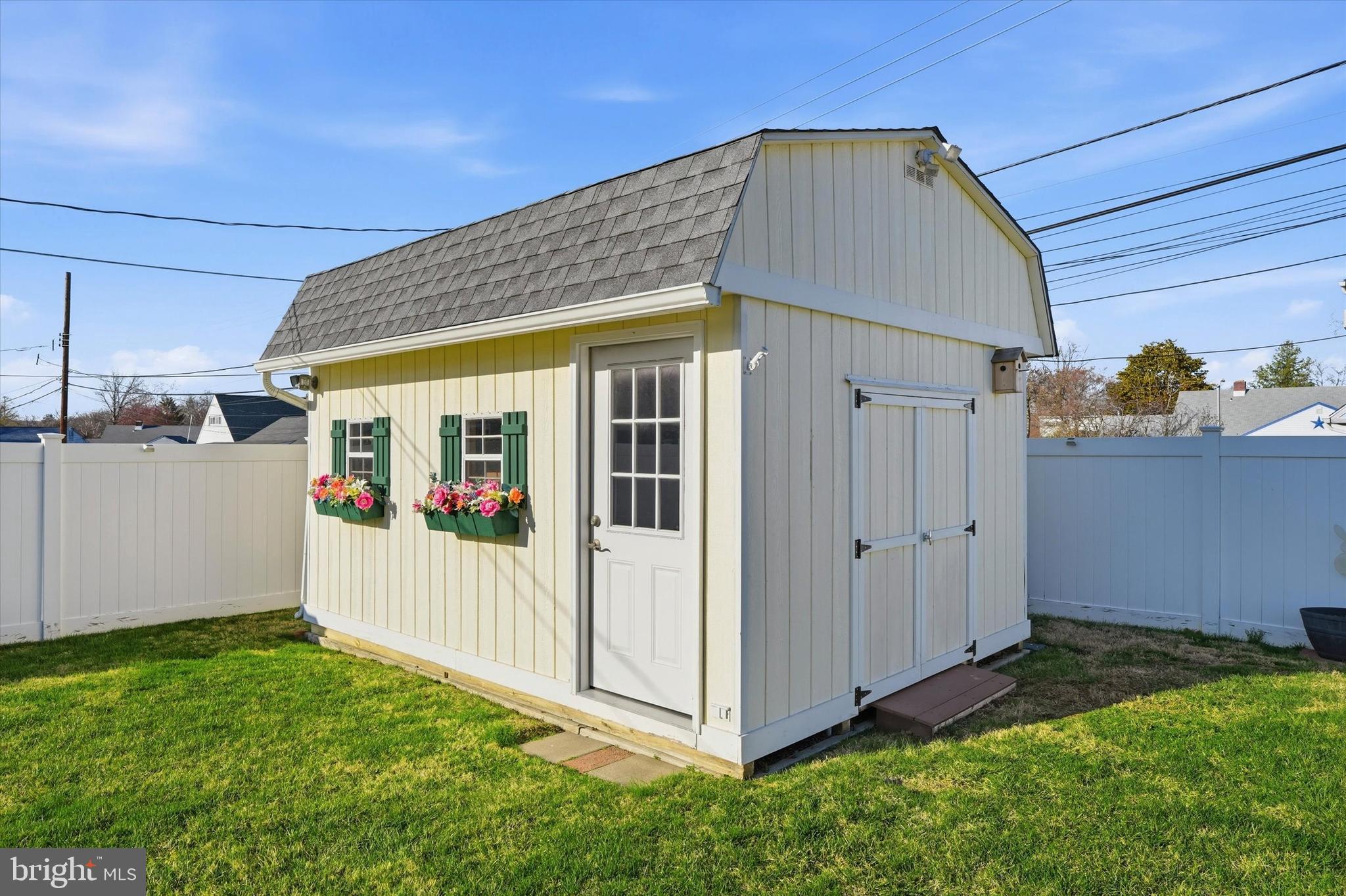 28 Sycamore Road Levittown, PA 19056 - Photo 28 of 31 a view of a house with backyard and wooden fence