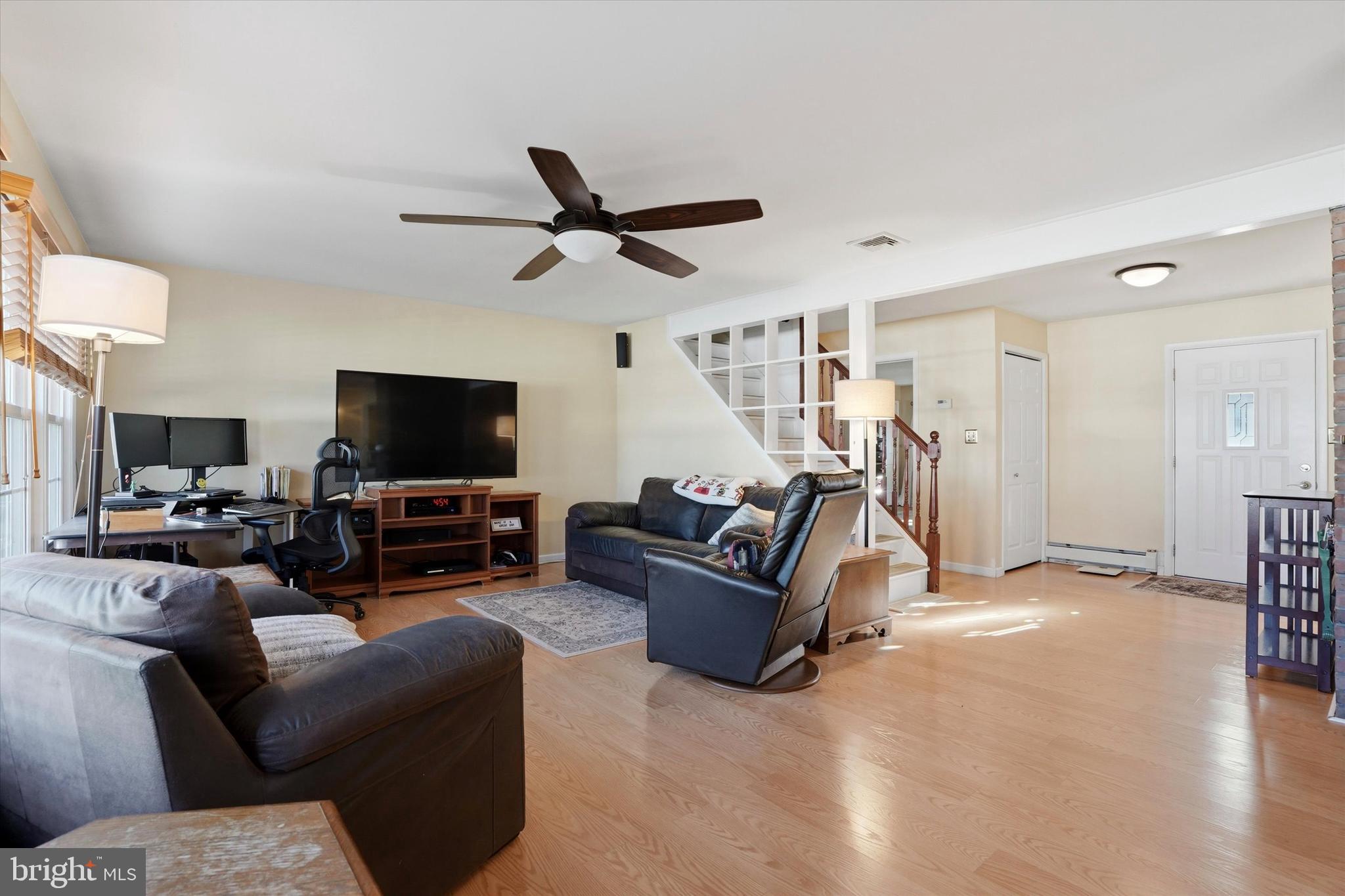 28 Sycamore Road Levittown, PA 19056 - Photo 4 of 31 a living room with furniture and a flat screen tv