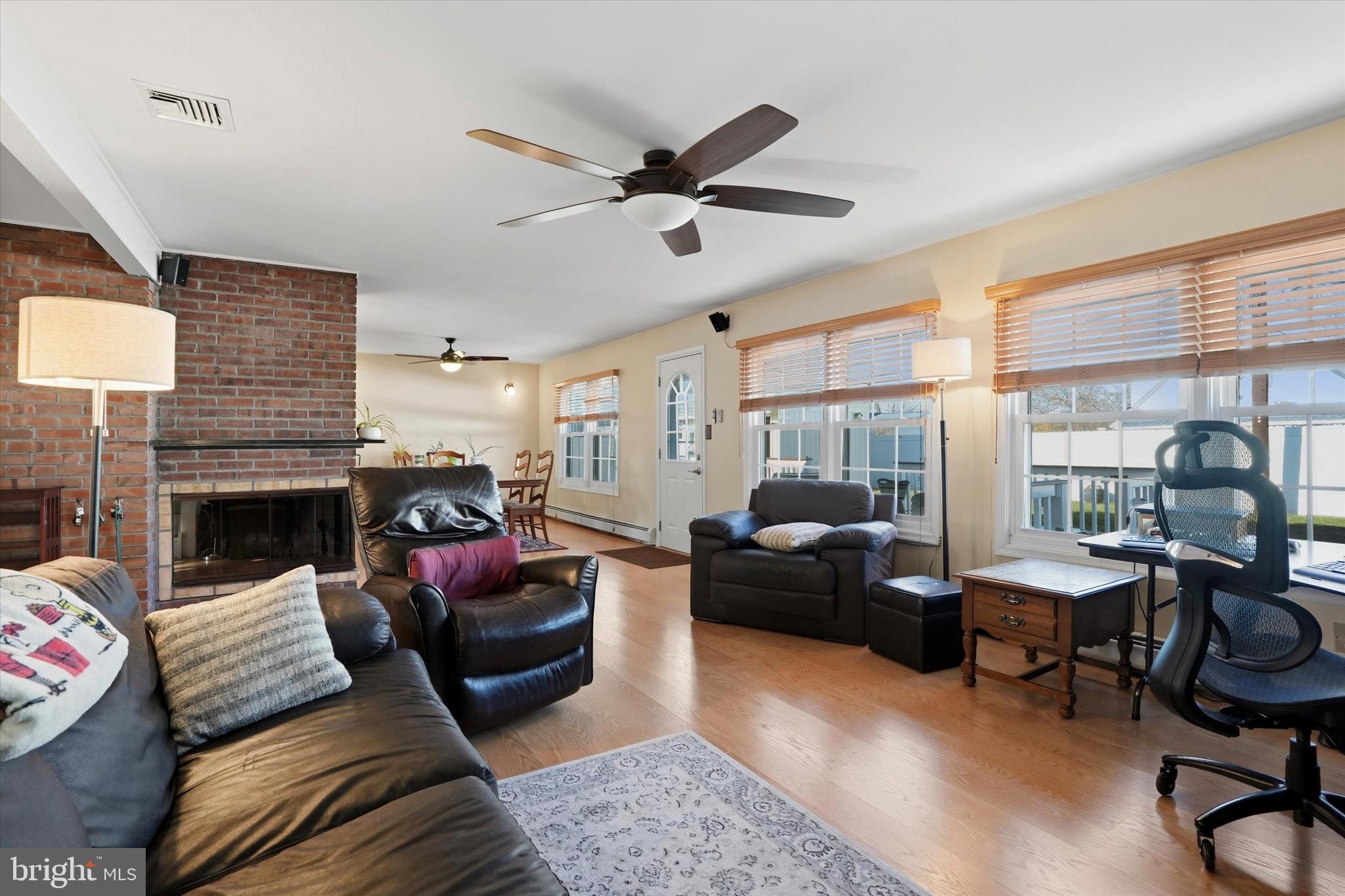 28 Sycamore Road Levittown, PA 19056 - Photo 5 of 31 a living room with furniture fireplace and a large window